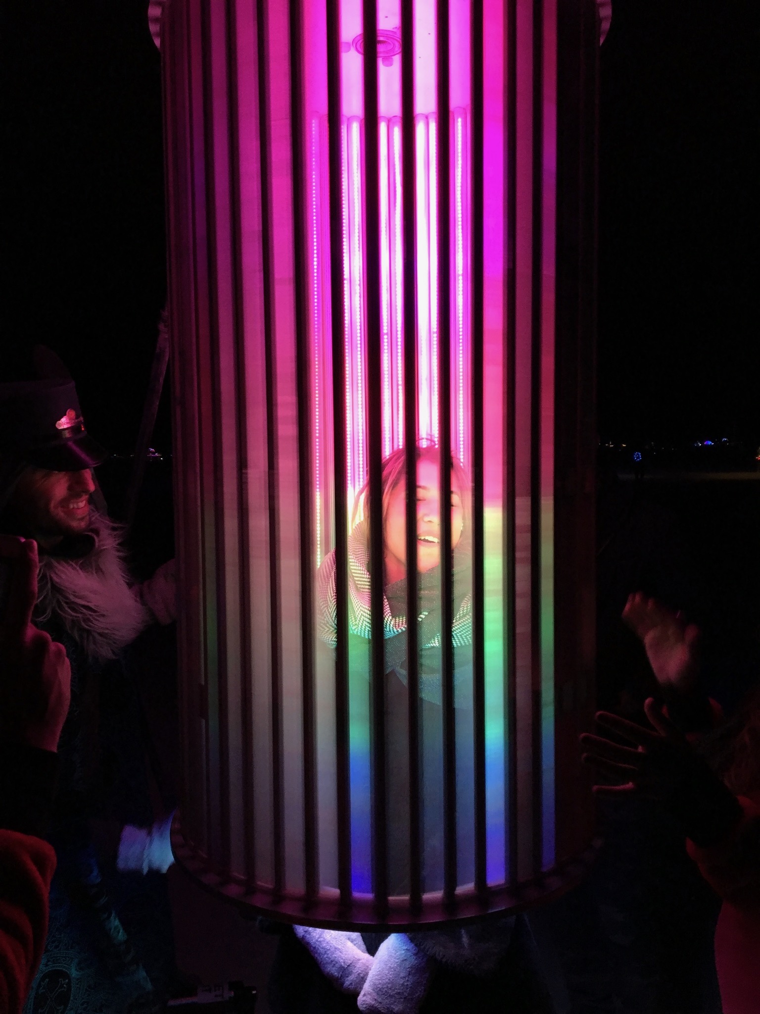 Participant inside the Strange Attractor experiencing LED light show